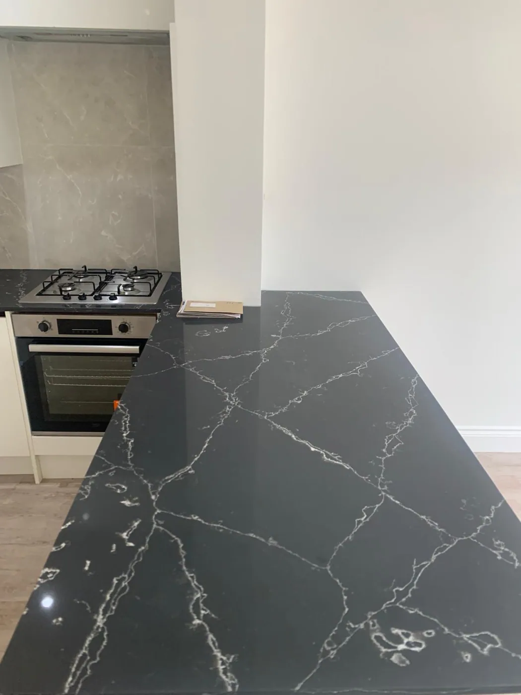 Separate kitchen with polished worktops